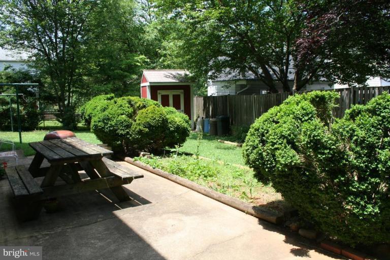 5903 Greentree Road Bethesda, MD 20817 - Photo 19 of 19 a view of backyard with a garden and outdoor seating