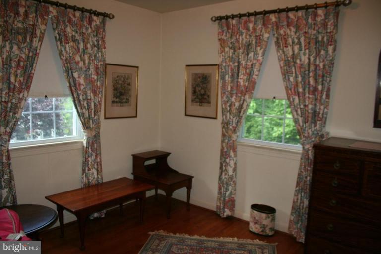 5903 Greentree Road Bethesda, MD 20817 - Photo 7 of 19 a living room with furniture and a window