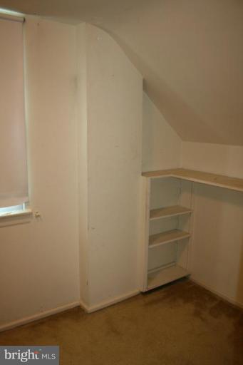 5903 Greentree Road Bethesda, MD 20817 - Photo 8 of 19 a view of an empty walk in closet