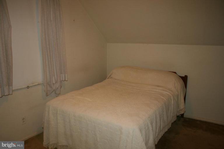 5903 Greentree Road Bethesda, MD 20817 - Photo 9 of 19 a close up of a bed in a room