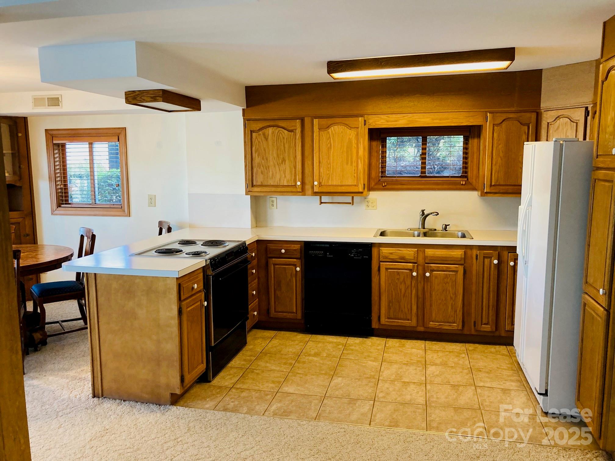 232 Hermance Lane Mooresville, NC 28117 - Photo 11 of 21 a kitchen with a sink stove and cabinets