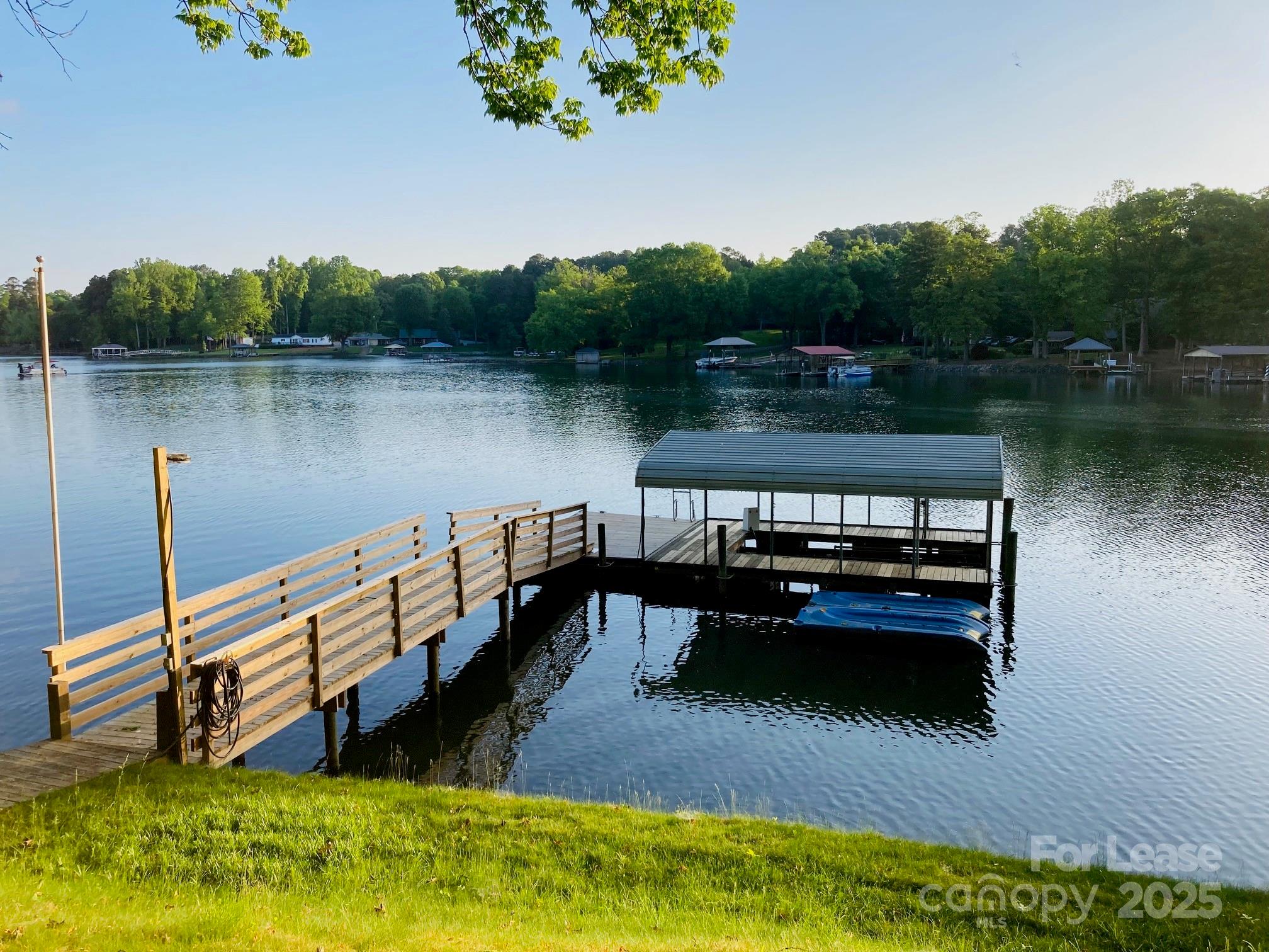232 Hermance Lane Mooresville, NC 28117 - Photo 2 of 21 a view of a wooden deck and lake view