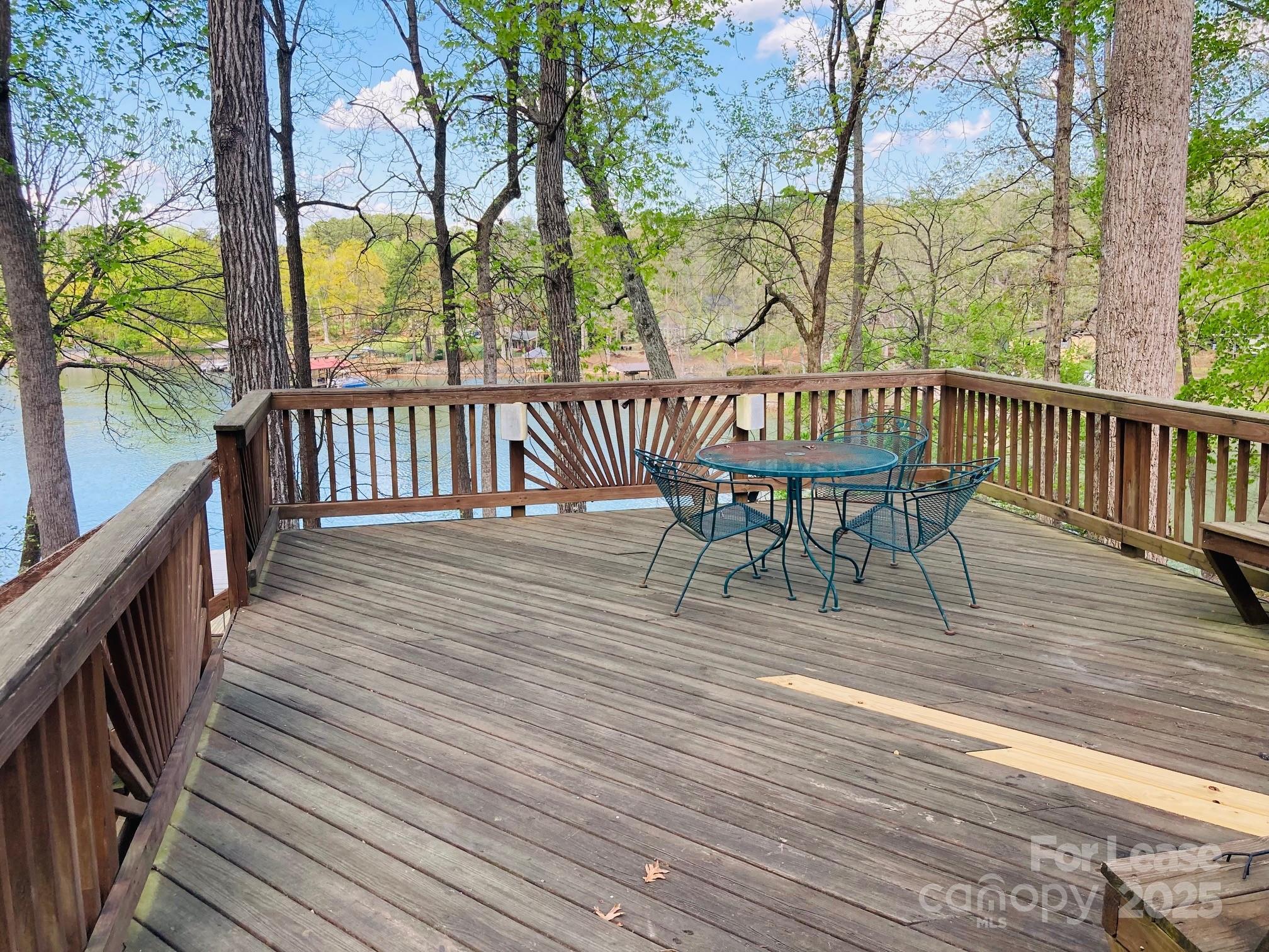 232 Hermance Lane Mooresville, NC 28117 - Photo 8 of 21 a view of balcony with wooden floor and outdoor seating