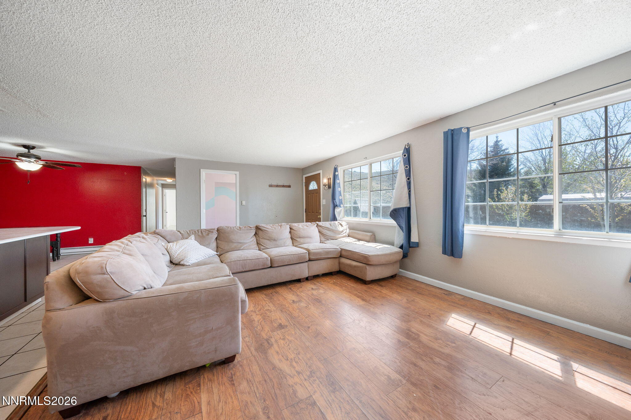 3590 Siskin Lane Reno, NV 89508 - Photo 5 of 31 a living room with furniture and a large window