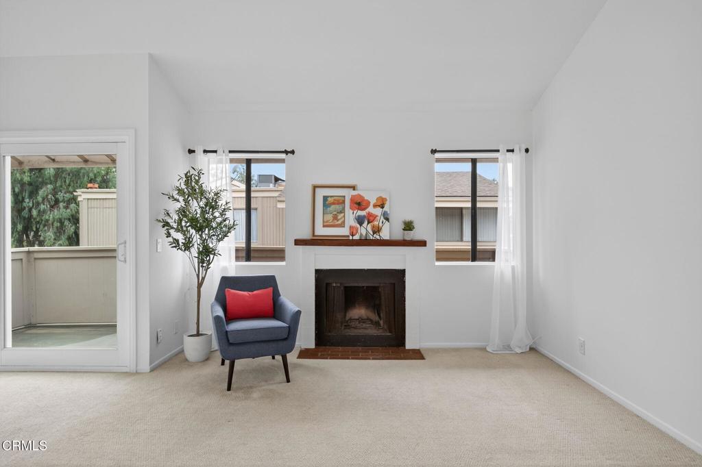 1466 San Simeon Court, Unit 2 Ventura, CA 93003 - Photo 1 of 41 a living room with furniture and a fireplace