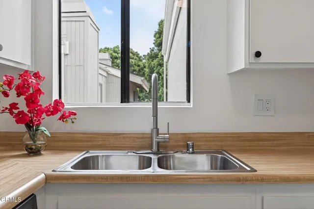 a kitchen view of a stove and a refrigerator