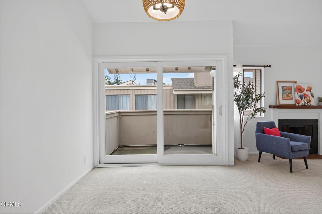 1466 San Simeon Court, Unit 2 Ventura, CA 93003 - Photo 12 of 41 a room with furniture and a potted plant