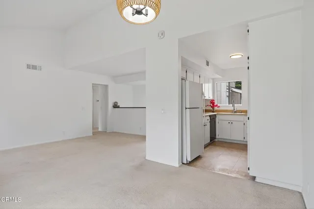 a room with furniture and a potted plant