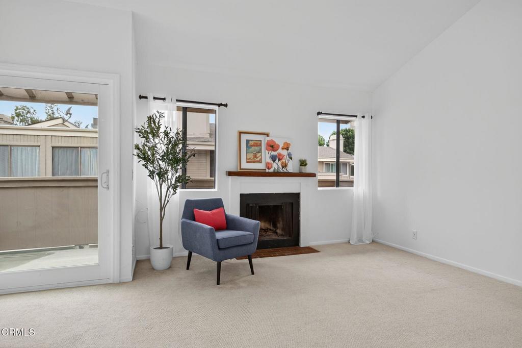 1466 San Simeon Court, Unit 2 Ventura, CA 93003 - Photo 17 of 41 a living room with furniture and a fireplace