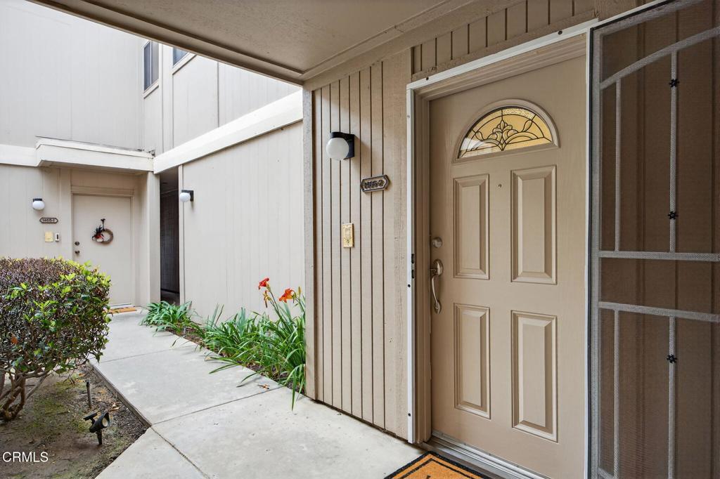 1466 San Simeon Court, Unit 2 Ventura, CA 93003 - Photo 2 of 41 a front view of a house with garden