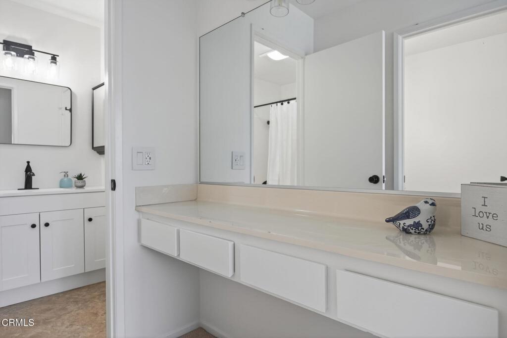 1466 San Simeon Court, Unit 2 Ventura, CA 93003 - Photo 21 of 41 a bathroom with a sink and a mirror