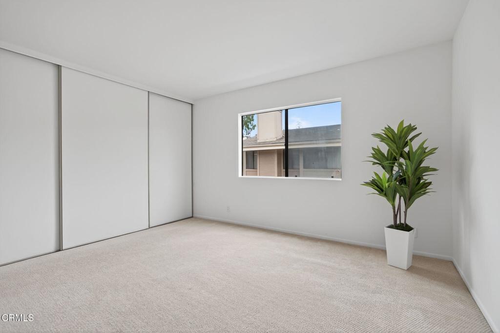 1466 San Simeon Court, Unit 2 Ventura, CA 93003 - Photo 23 of 41 a view of an empty room with a potted plant