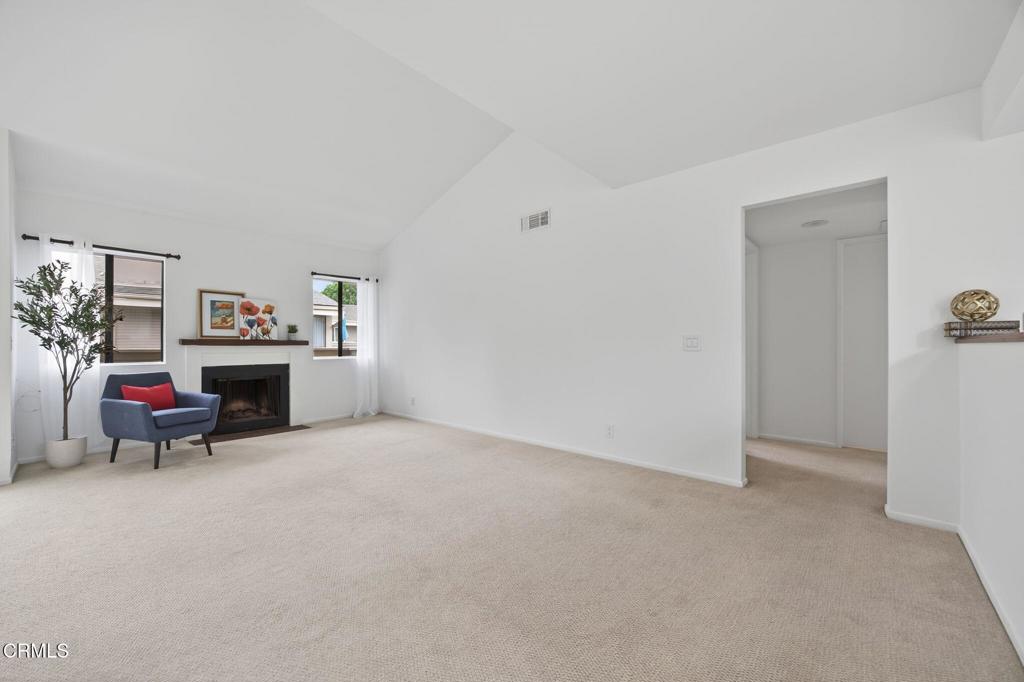 1466 San Simeon Court, Unit 2 Ventura, CA 93003 - Photo 39 of 41 a view of livingroom with furniture and a fireplace