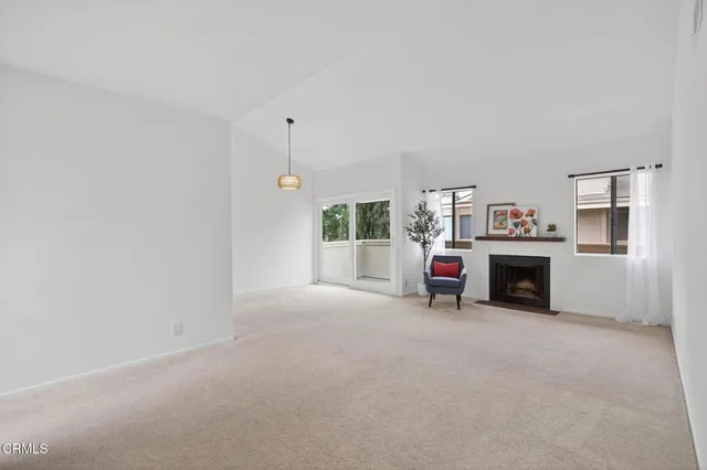 a view of livingroom with furniture and a fireplace
