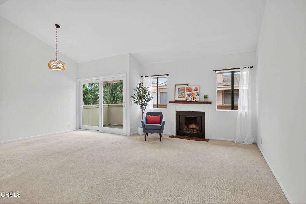 1466 San Simeon Court, Unit 2 Ventura, CA 93003 - Photo 6 of 41 a view of a livingroom with a fireplace and window