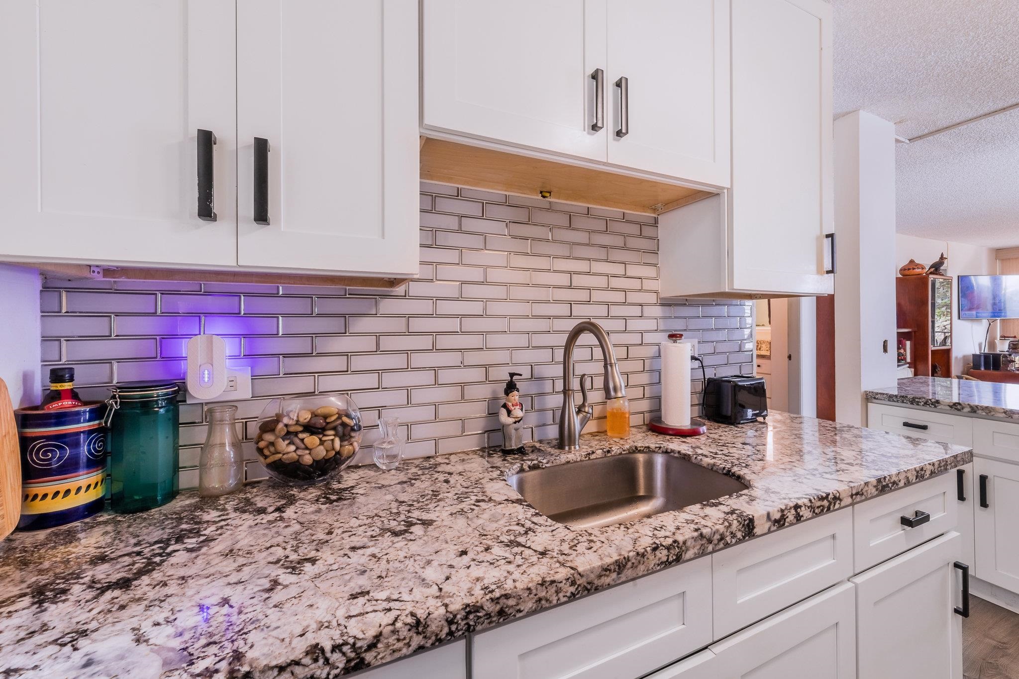 a kitchen with sink cabinets and stove