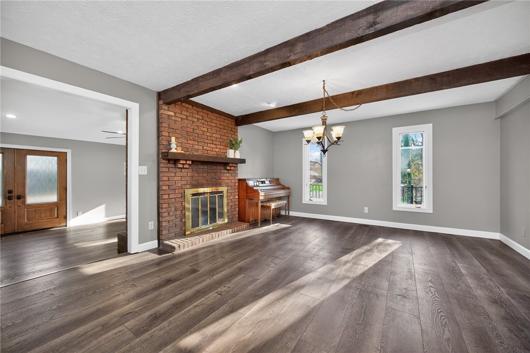 4747 Fawnwood Road Dayton, OH 45429 - Photo 11 of 58 This inviting living space features warm wood flooring and exposed ceiling beams, perfect for everyday living.
