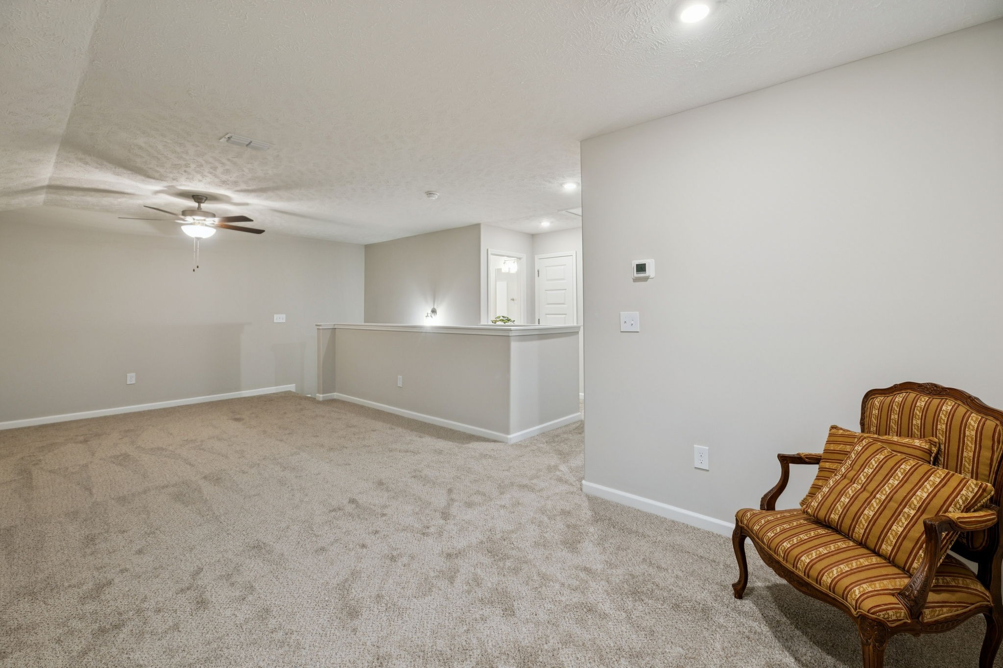143 Creek Wood Road Manchester, TN 37355 - Photo 21 of 29 an empty room with windows and ceiling fan