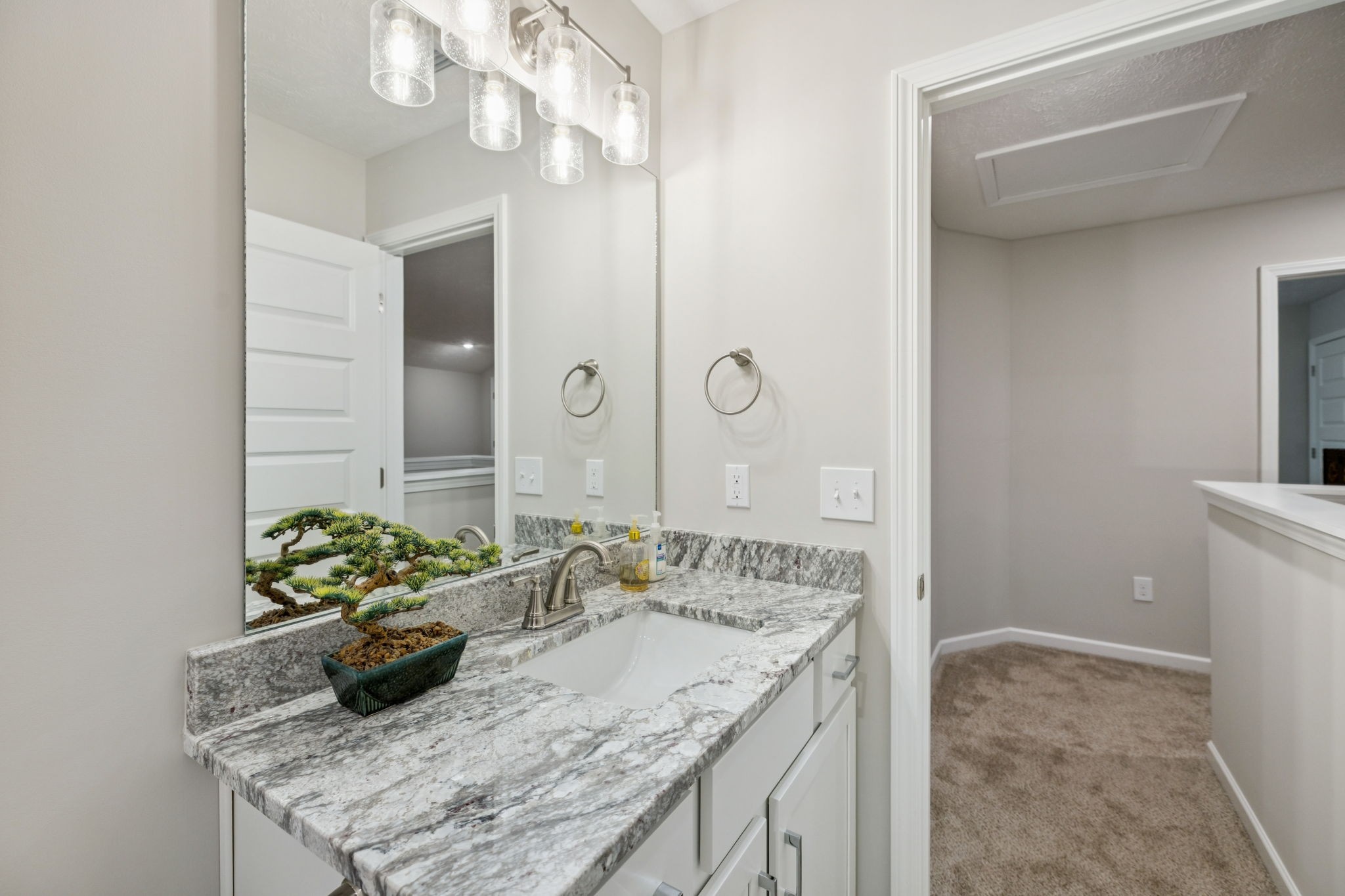 143 Creek Wood Road Manchester, TN 37355 - Photo 26 of 29 a bathroom with a granite countertop sink a large mirror and a shower