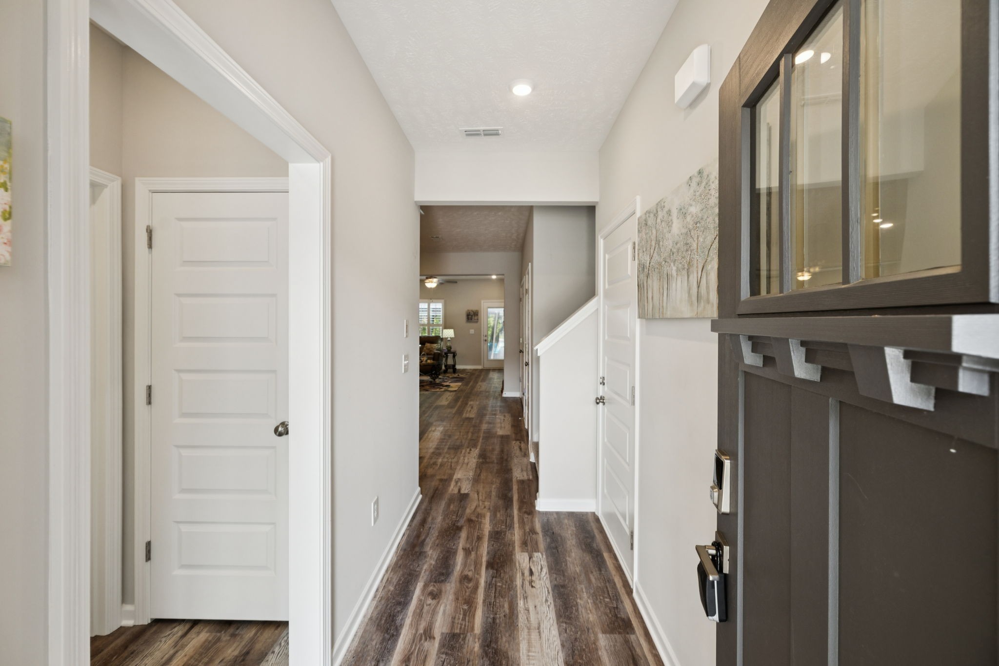 143 Creek Wood Road Manchester, TN 37355 - Photo 3 of 29 a view of a hallway with wooden floor and staircase