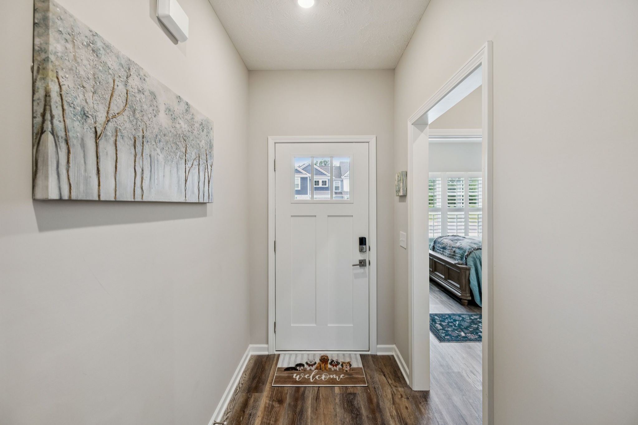 143 Creek Wood Road Manchester, TN 37355 - Photo 4 of 29 a view of a hallway with wooden floor and a bathroom