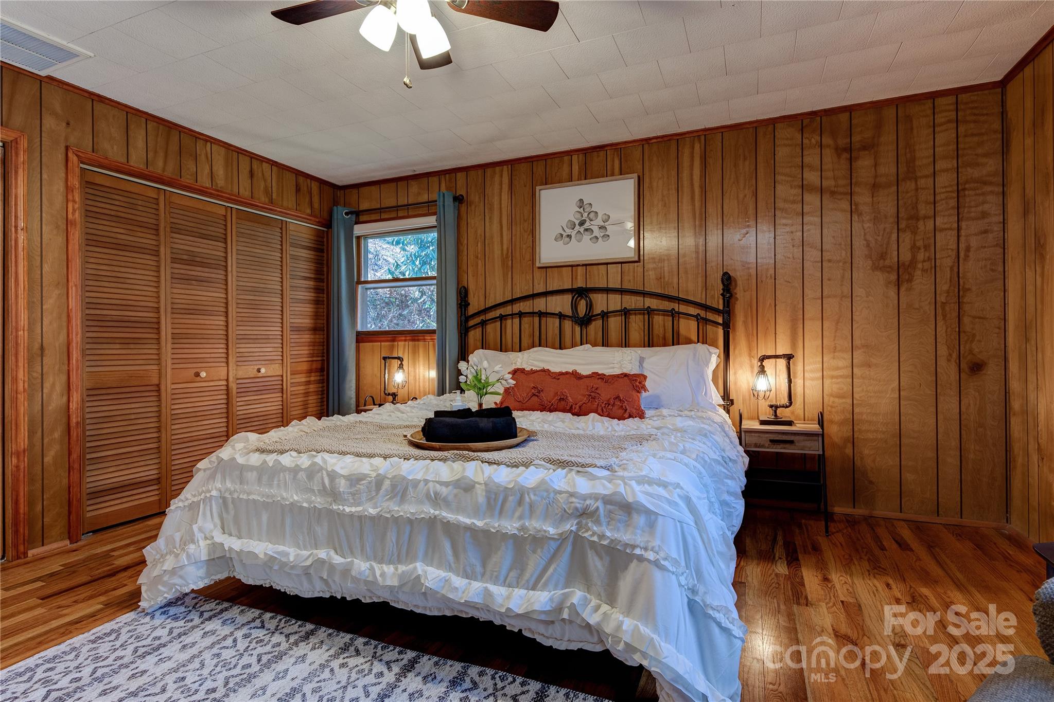 4050 Pickens Highway Rosman, NC 28772 - Photo 20 of 31 a bedroom with a bed and wooden floor