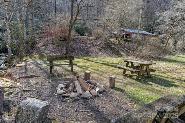 a view of a backyard with sitting area