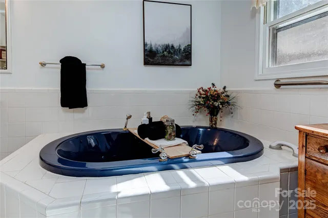 a table with a vase and flowers on it