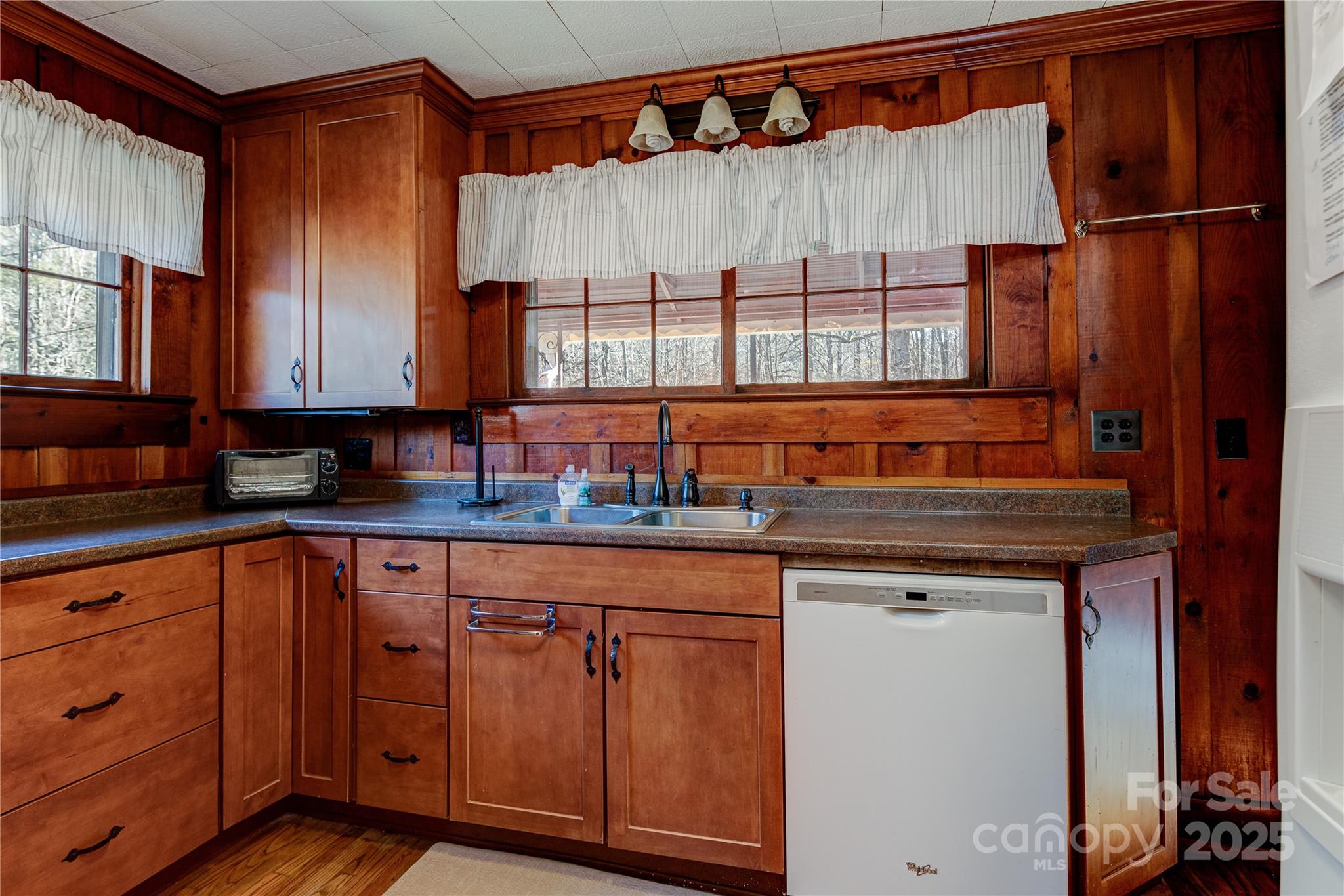 4050 Pickens Highway Rosman, NC 28772 - Photo 7 of 31 a kitchen with stainless steel appliances granite countertop a sink and a cabinets