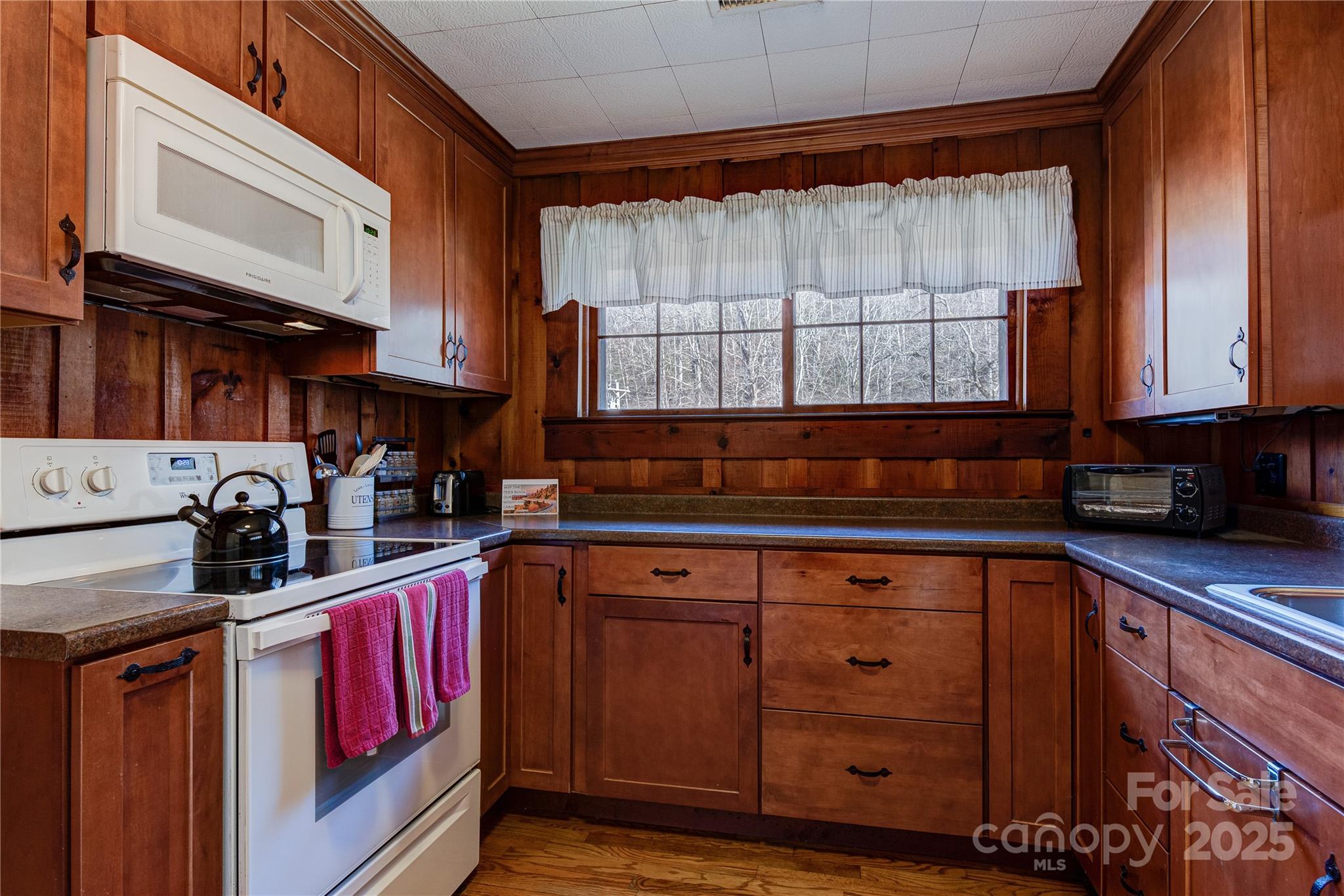 4050 Pickens Highway Rosman, NC 28772 - Photo 8 of 31 a kitchen with stainless steel appliances granite countertop a sink stove and cabinets