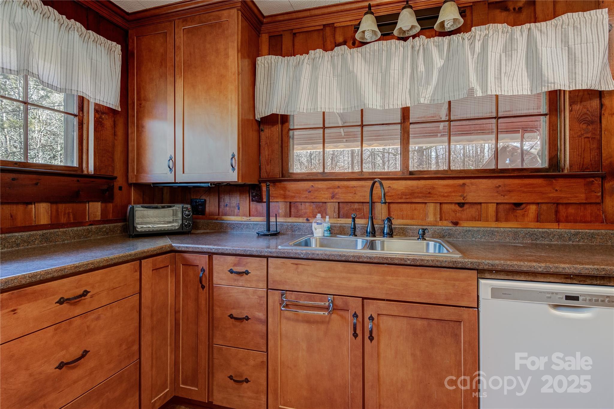 4050 Pickens Highway Rosman, NC 28772 - Photo 9 of 31 a kitchen with stainless steel appliances granite countertop a sink a stove and a microwave oven