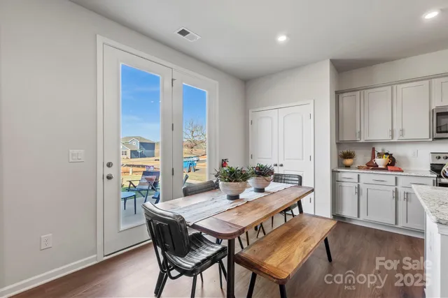 a kitchen with a table and chairs in it