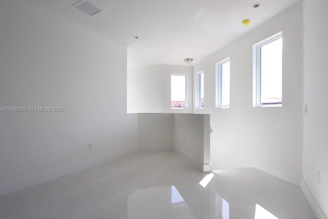 15631 Southwest 11th Terrace Miami, FL 33194 - Photo 18 of 43 a view of an empty room with a window