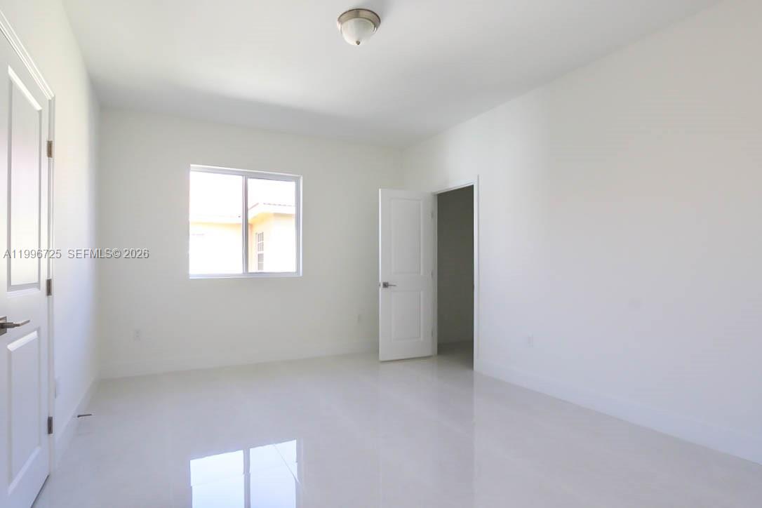 15631 Southwest 11th Terrace Miami, FL 33194 - Photo 19 of 43 a view of an empty room with a window