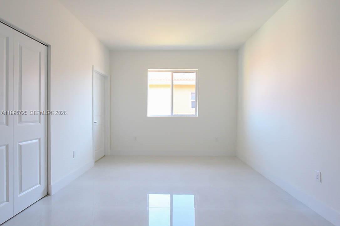 15631 Southwest 11th Terrace Miami, FL 33194 - Photo 33 of 43 an empty room with a window