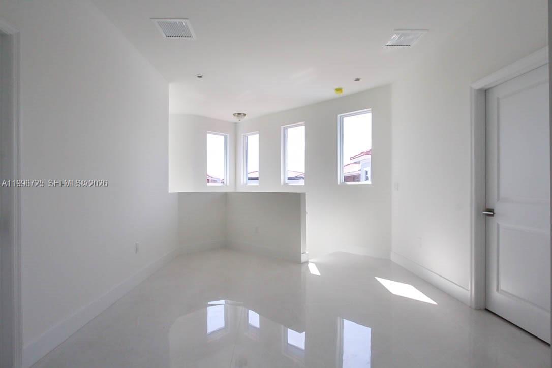 15631 Southwest 11th Terrace Miami, FL 33194 - Photo 34 of 43 a view of an empty room with a window