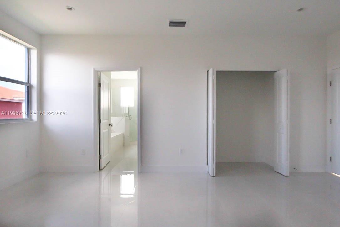 15631 Southwest 11th Terrace Miami, FL 33194 - Photo 4 of 43 an empty room with windows and closet