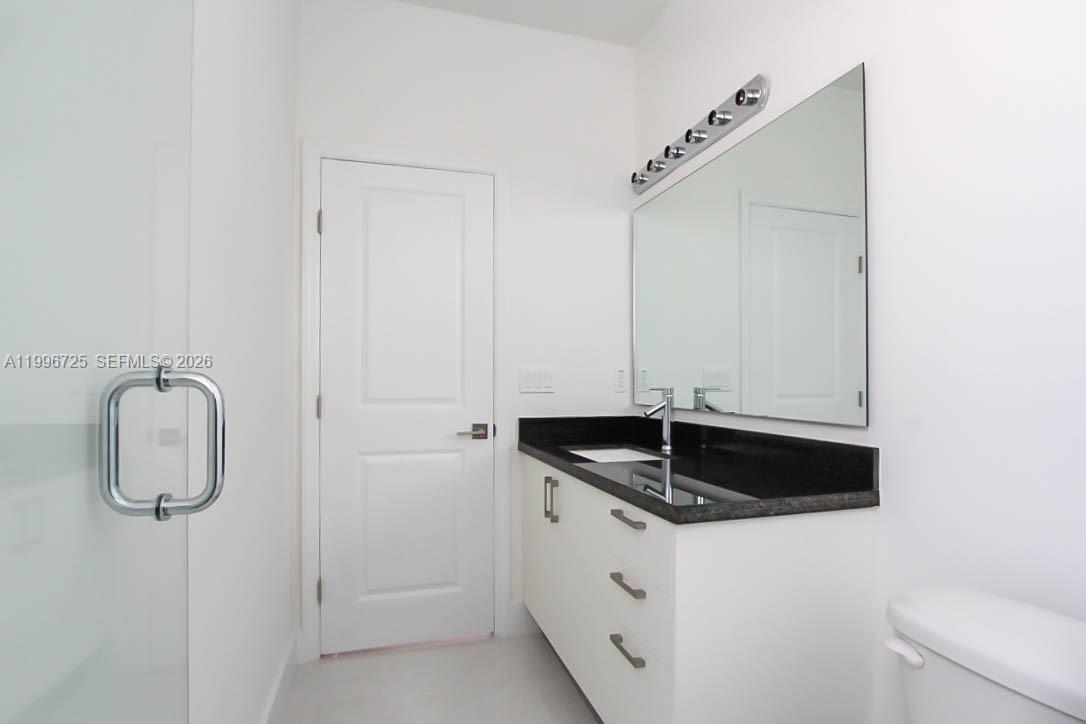 15631 Southwest 11th Terrace Miami, FL 33194 - Photo 5 of 43 a bathroom with a granite countertop sink and a mirror