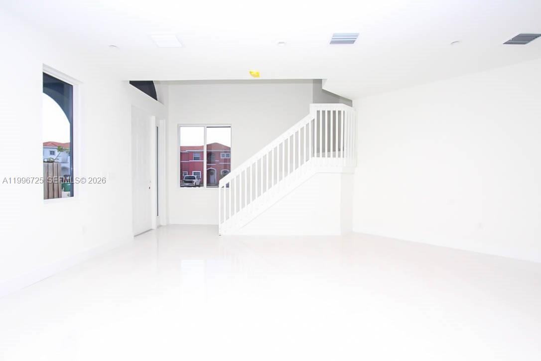 15631 Southwest 11th Terrace Miami, FL 33194 - Photo 7 of 43 a view of a hallway with staircase