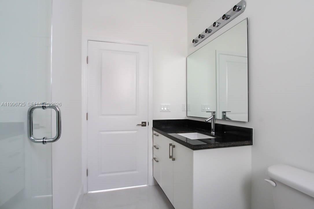 15631 Southwest 11th Terrace Miami, FL 33194 - Photo 8 of 43 a bathroom with a granite countertop sink and a granite