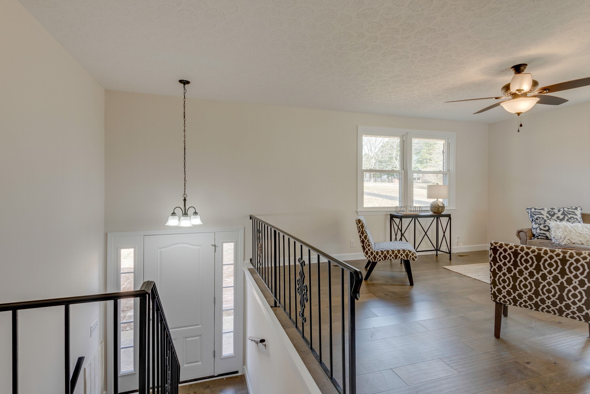 2016 Abiff Road Burns, TN 37029 - Photo 13 of 30 a view of a hallway with windows and chandelier