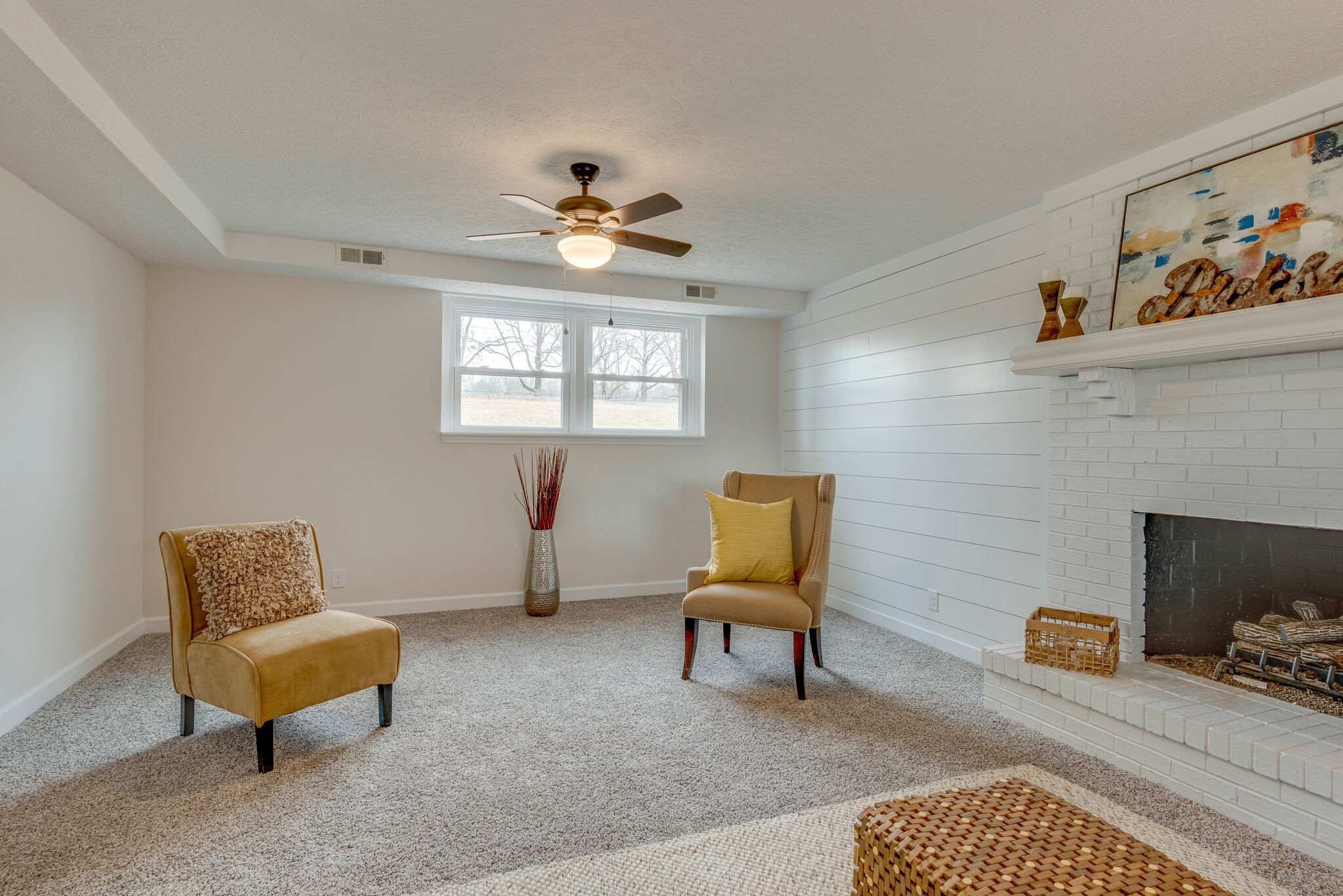2016 Abiff Road Burns, TN 37029 - Photo 17 of 30 a living room with furniture a piano and a fireplace