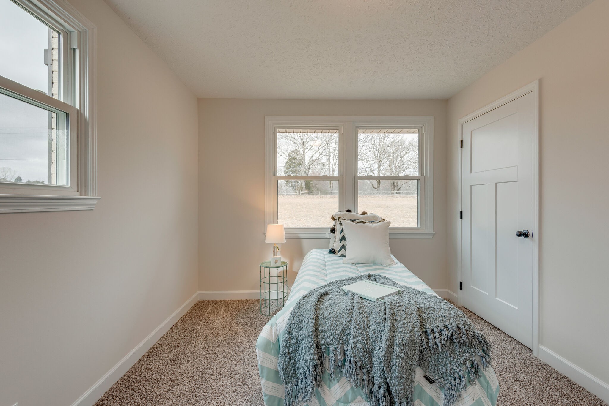 2016 Abiff Road Burns, TN 37029 - Photo 19 of 30 a bed sitting in a bedroom next to a window