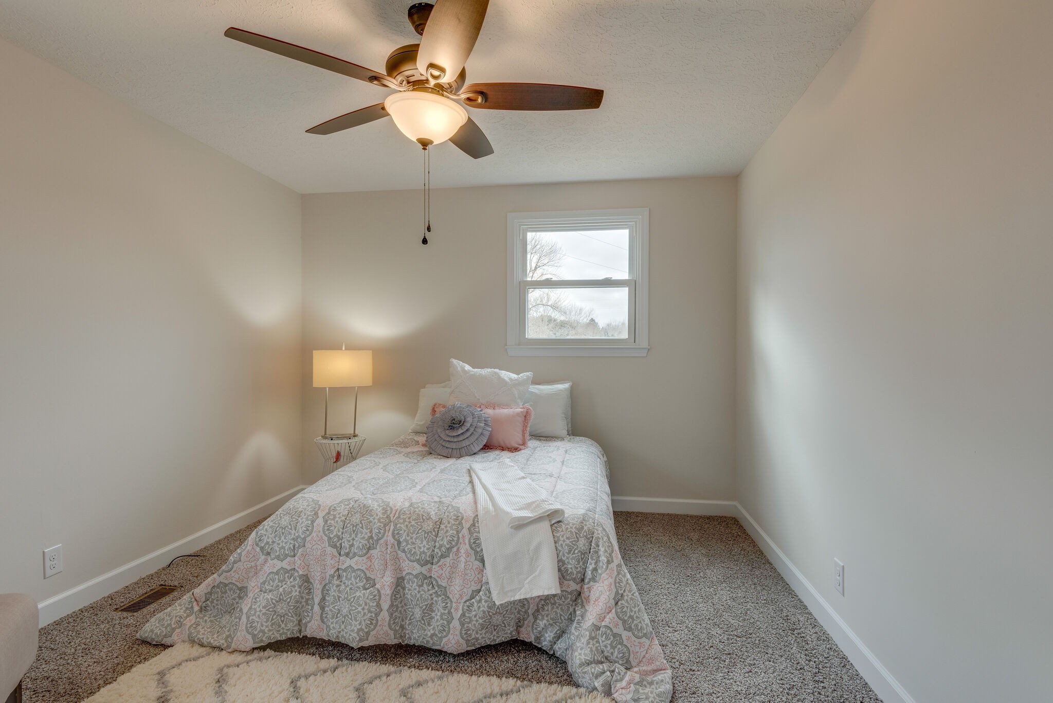2016 Abiff Road Burns, TN 37029 - Photo 20 of 30 a bedroom with a bed and a ceiling fan