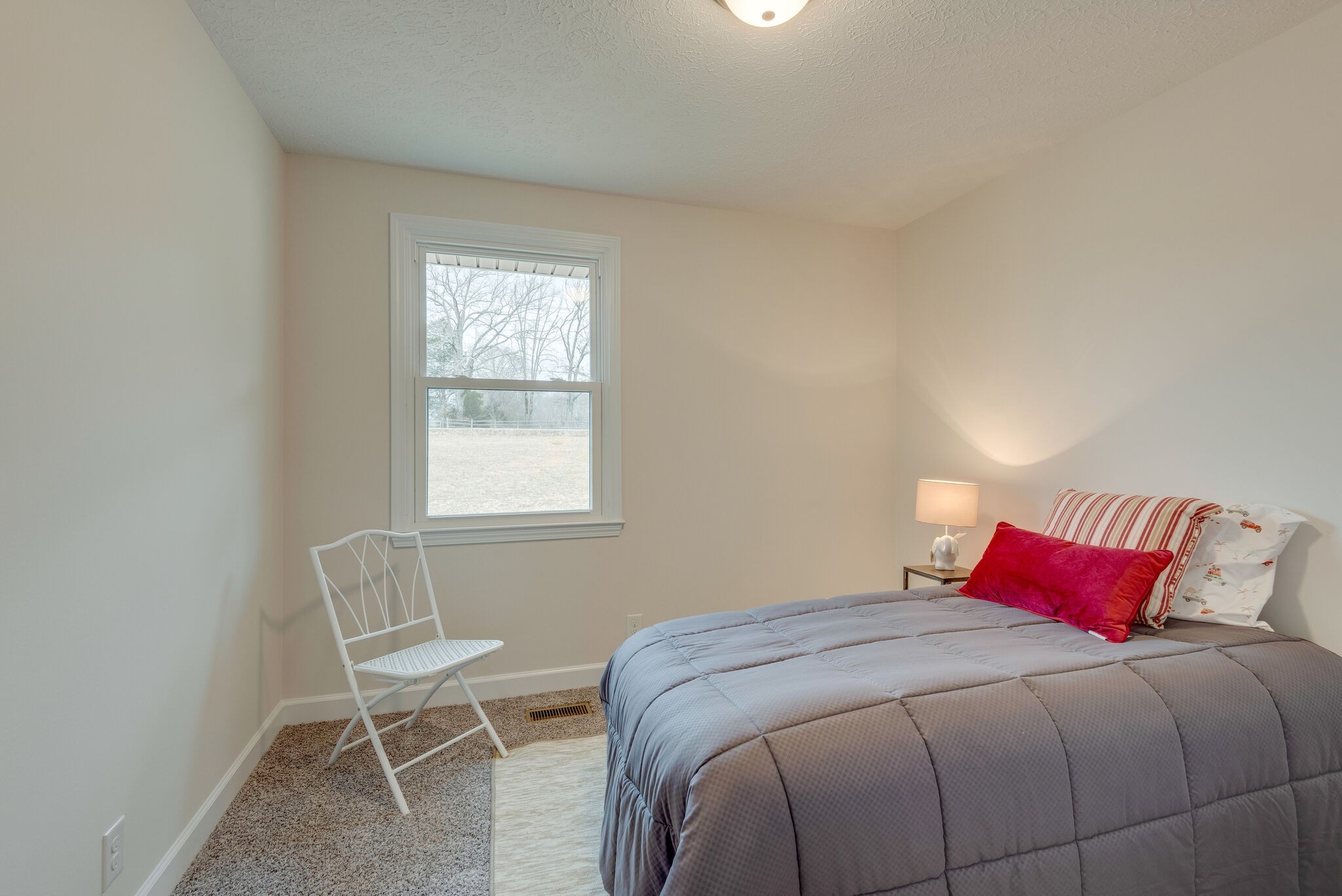 2016 Abiff Road Burns, TN 37029 - Photo 22 of 30 a bedroom with a bed and chair