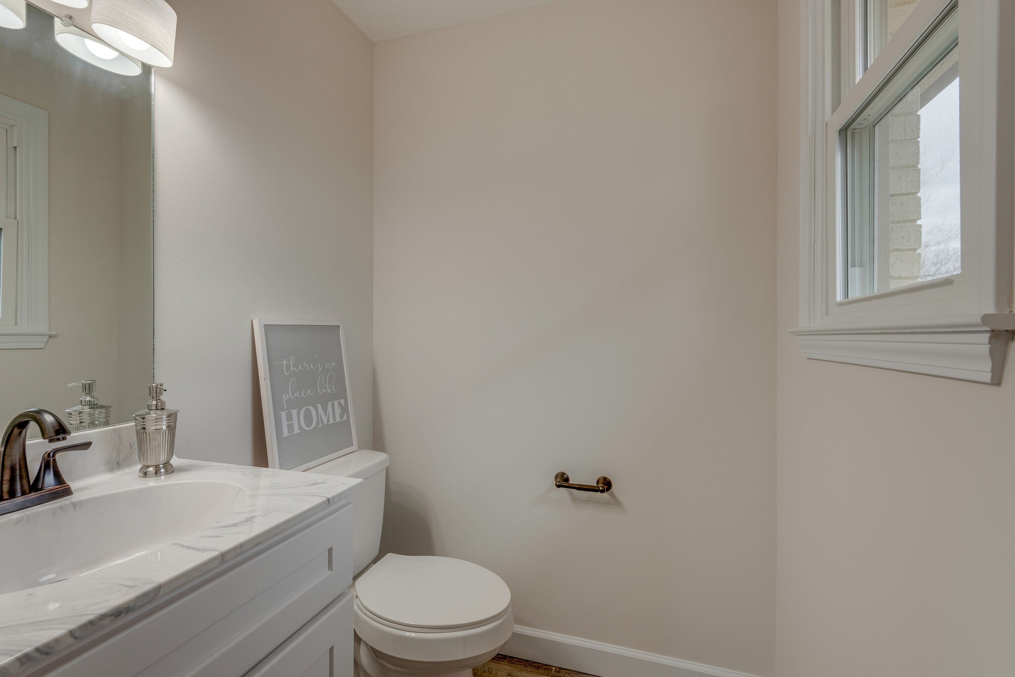 2016 Abiff Road Burns, TN 37029 - Photo 24 of 30 a bathroom with a white toilet sitting next to a sink