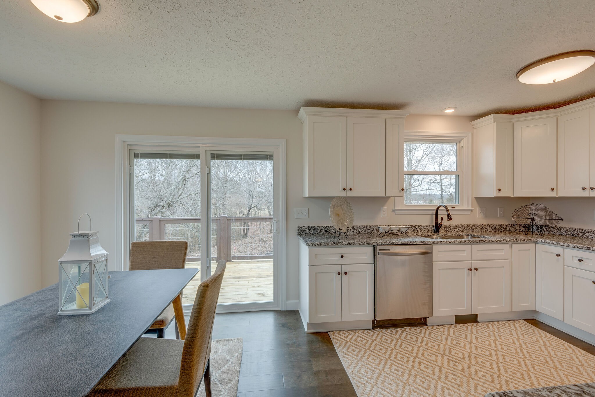 2016 Abiff Road Burns, TN 37029 - Photo 10 of 30 a kitchen with a stove a sink a dining table and chairs
