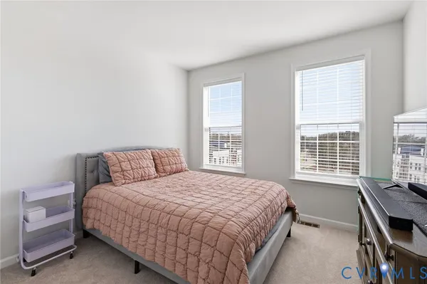 a bedroom with a bed bed and window