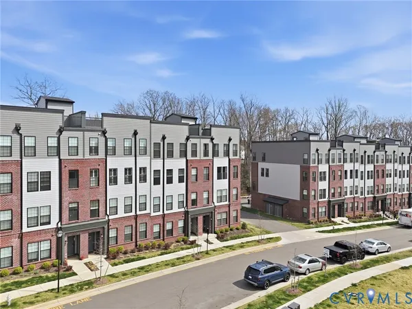 a view of a building with a yard