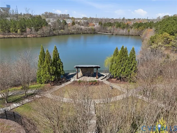 an aerial view of a house with a lake view
